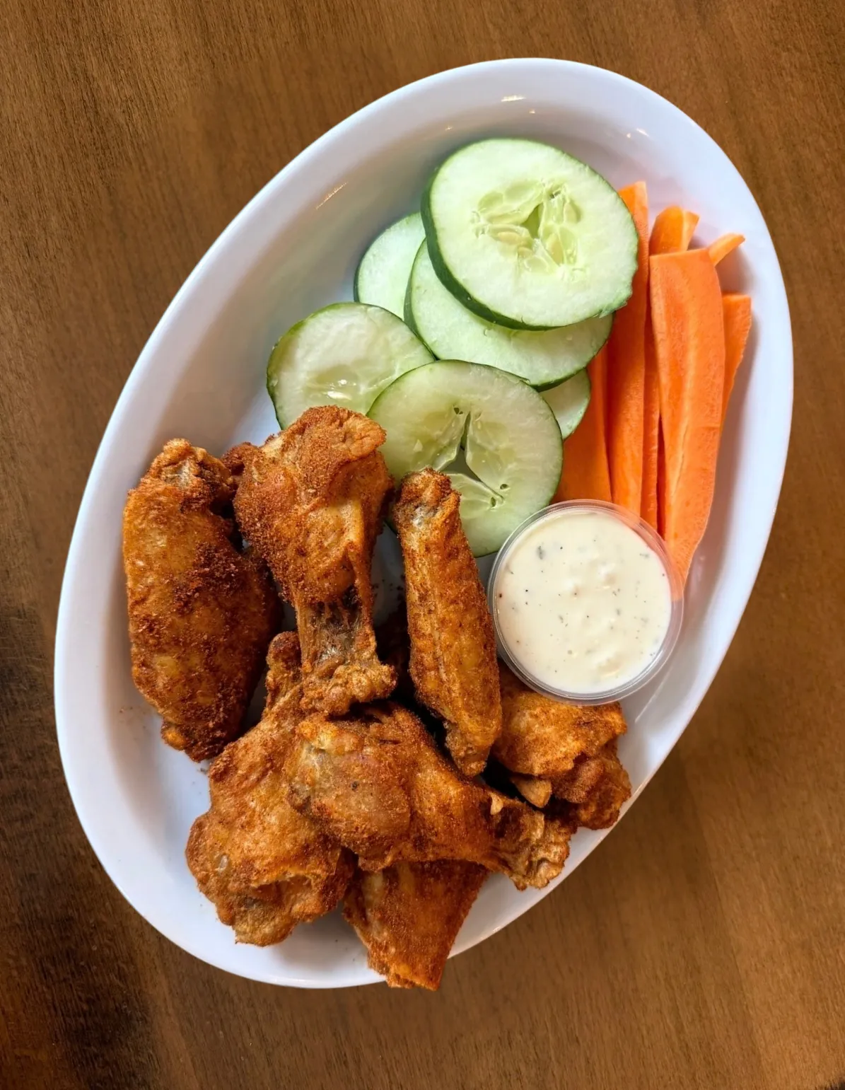 Dry rub wings with veggies and ranch.