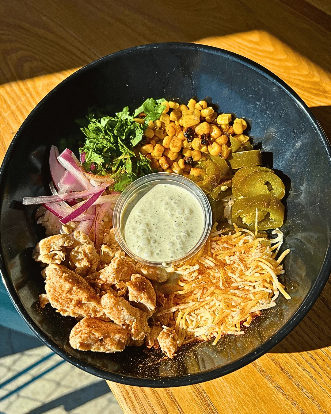 A southwest bowl on a table. picture from an above angle.