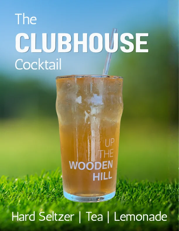 A glass of the clubhouse tea with a golf ball and a putter