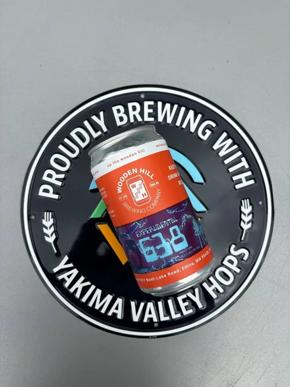 photograph of a big can of experimental 638 IPA on a tin tacker that reads "Proudly brewing with yakima valley hops"