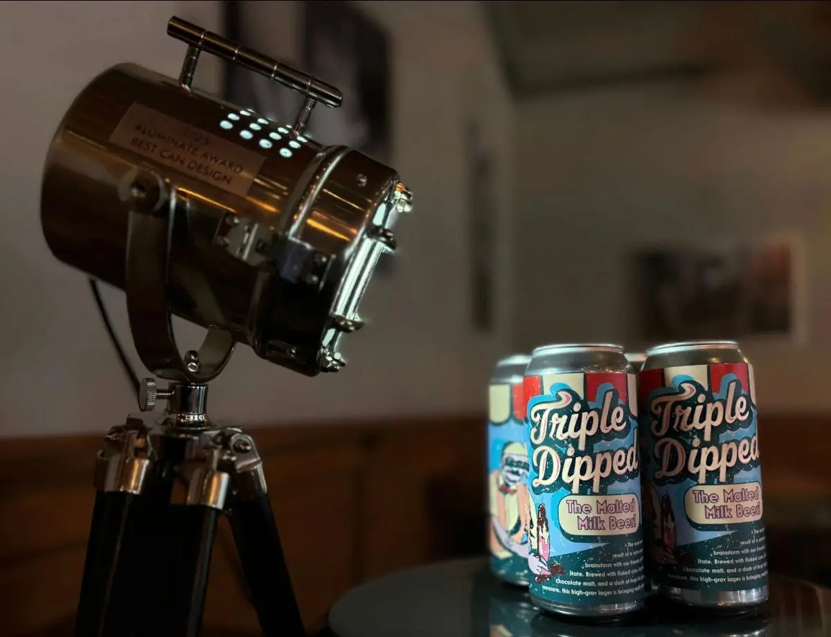 Picture of Triple Dipped cans lighted by the 2025 Aluminate Award light.