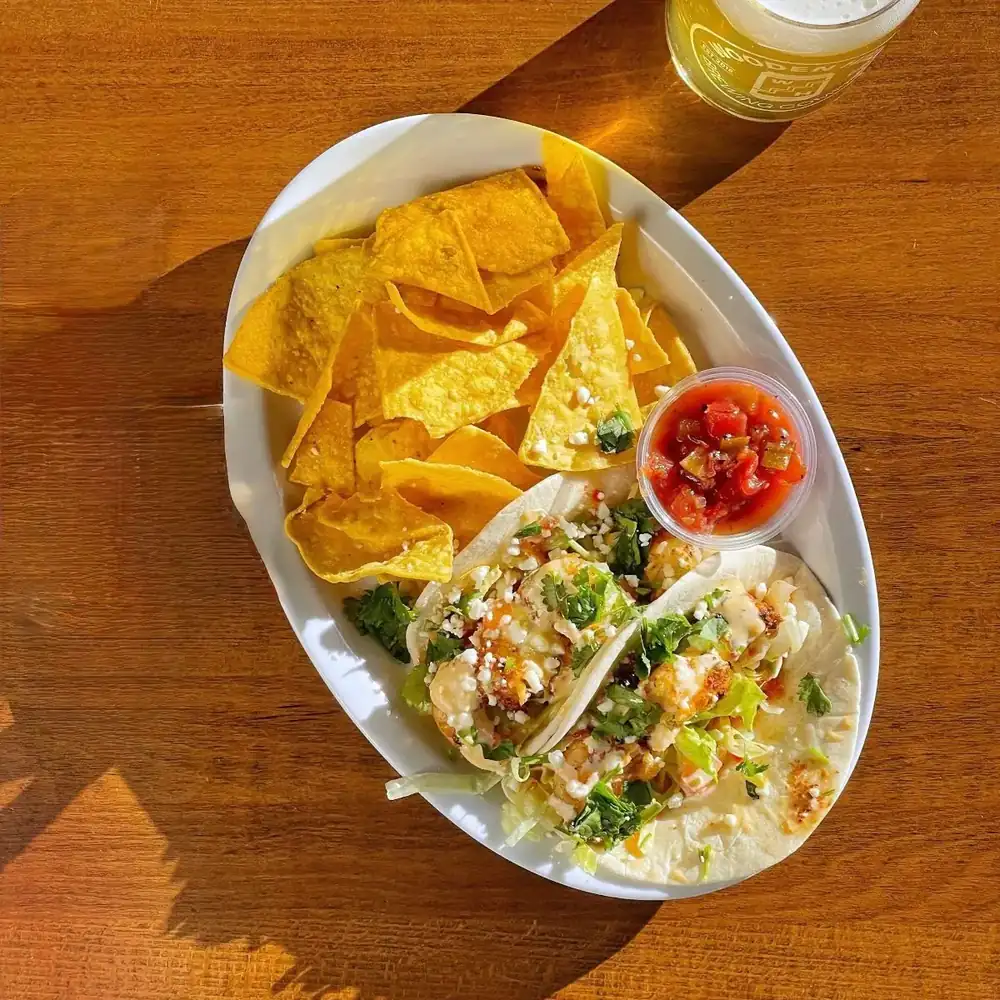 photo of cajun shrimp tacos and chips and salsa