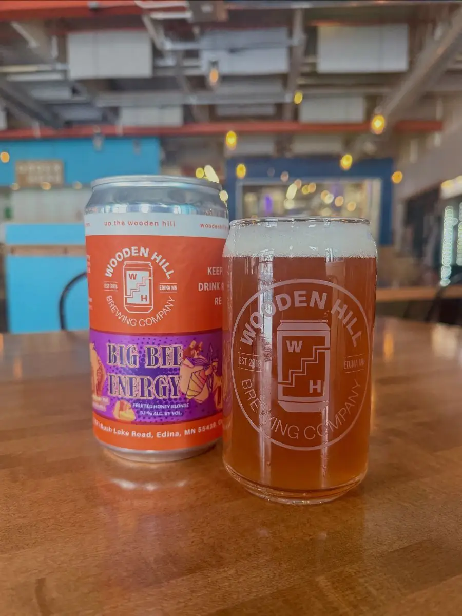 Big Bee Energy crowler and a glass