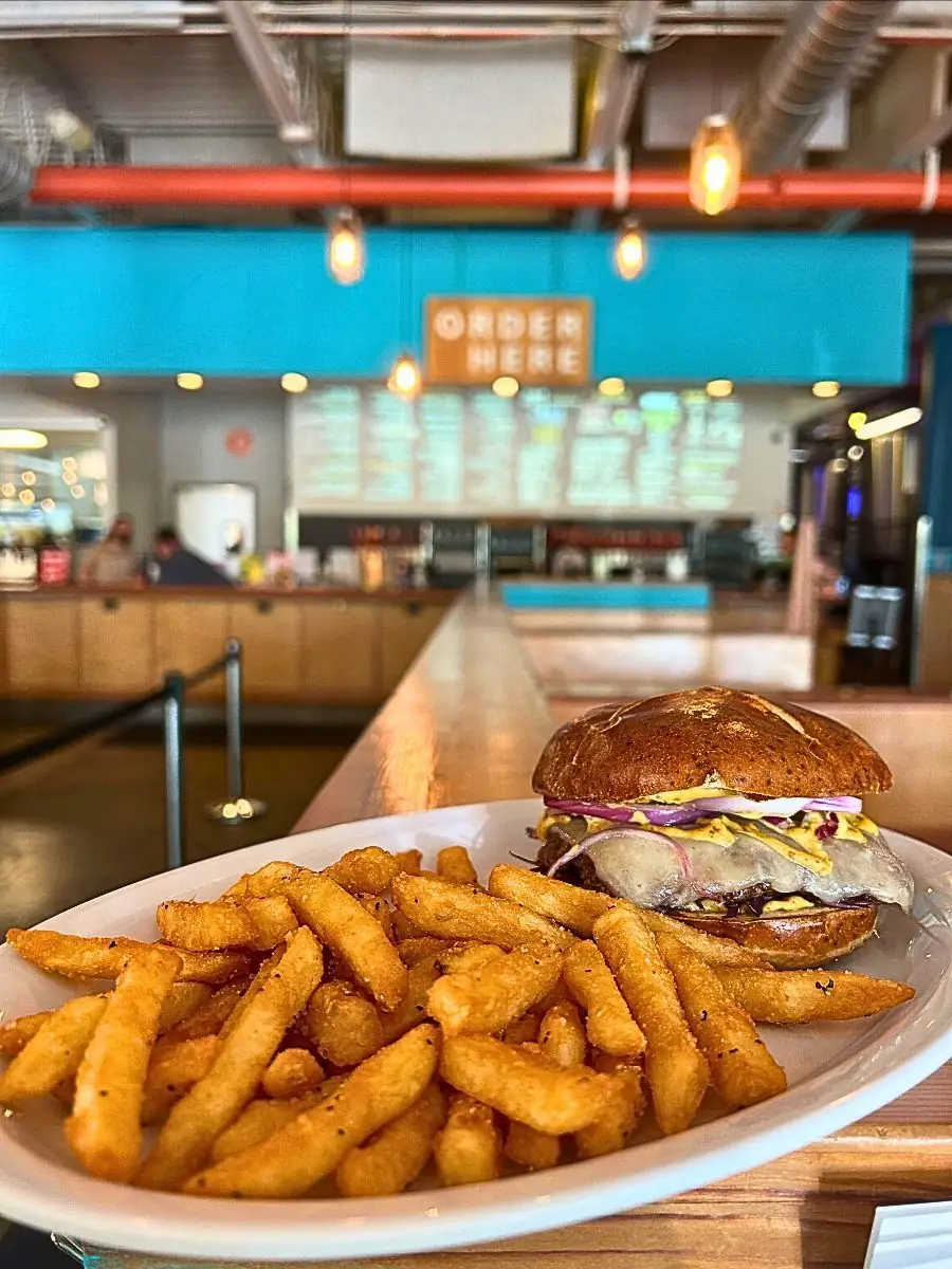 Releasing this Thursday May 21st. A mouth-watering Bavarian Pub Burger served with a side of crispy seasoned french fries. This delicious taproom special features a juicy Angus beef patty, melted white cheddar, crisp cabbage, red onion, and tangy ale mustard, all perfectly nestled inside a soft, toasted pretzel bun.