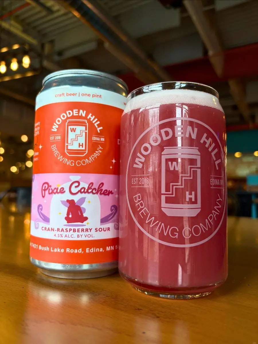 Wooden Hill branded can with Pixie Catcher logo. Wooden Hill branded glass with raspberry colored beer.