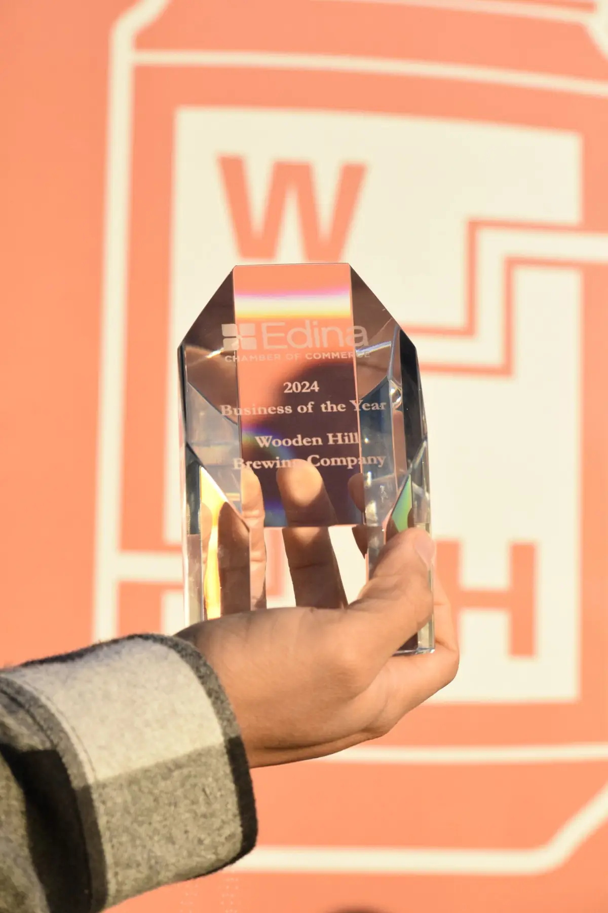 photo of an award that states edina chamber of commerce 2024 business of the year Wooden hill brewing company