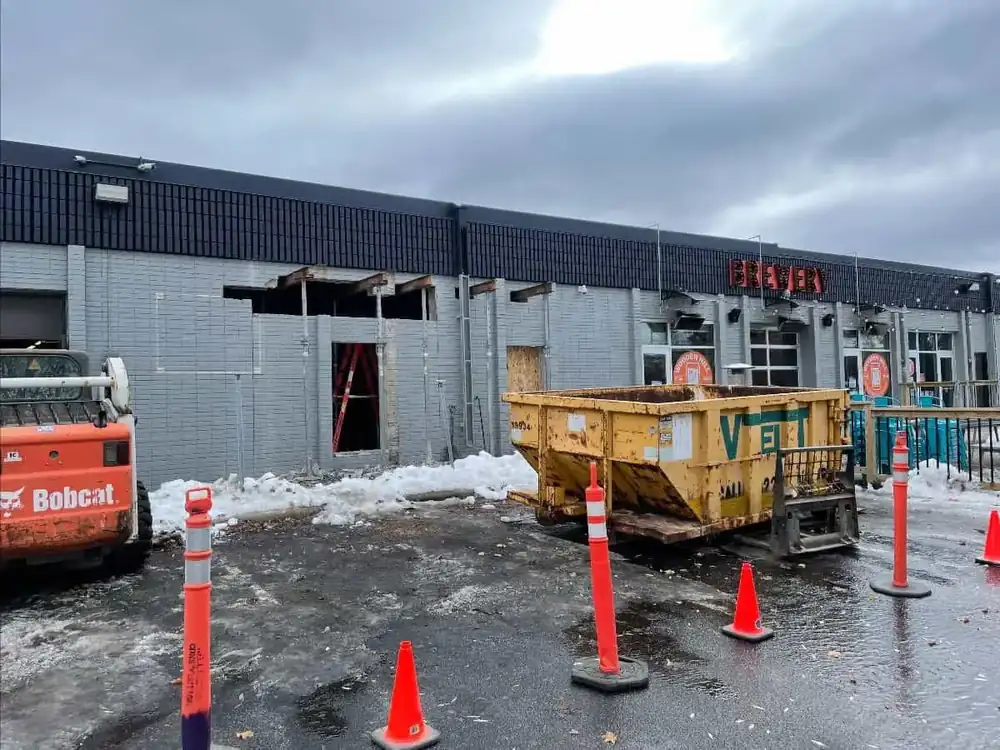 a photo of the beginnings of the expanded patio outside of the front entrance to the Wooden Hill taproom 